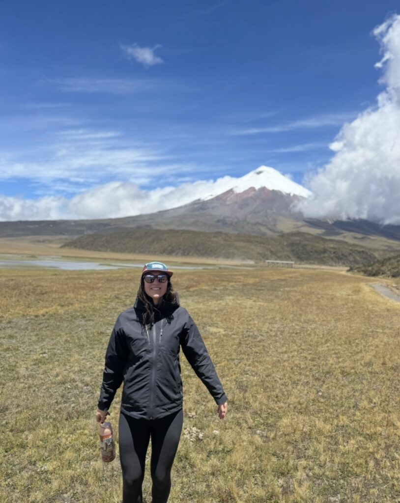 Traveler standing in front of Cotopaxi Volcano