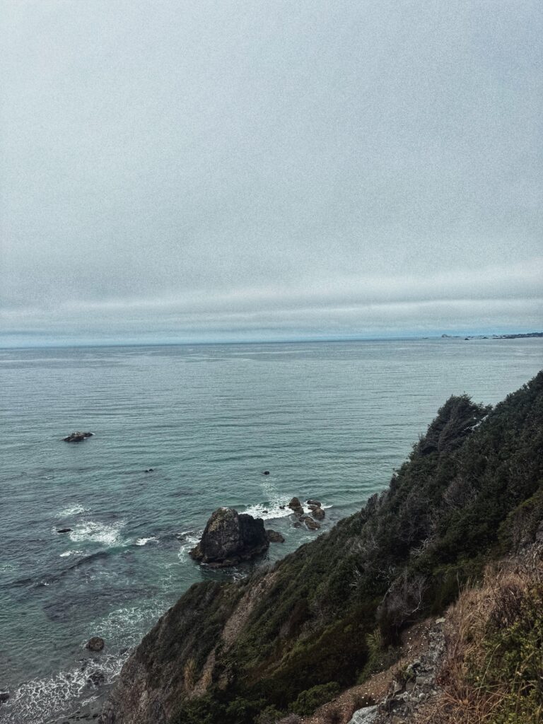 Dramatic Northern California coastline with waves crashing along Crescent Beach near Redwoods National Park